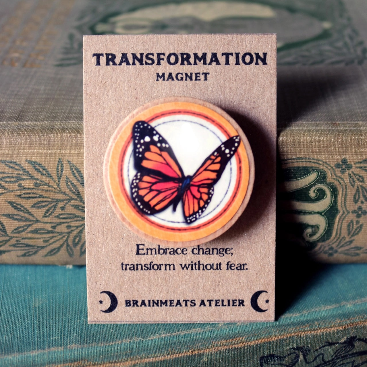 Butterfly magnet on a card with 'Transformation Magnet' text, featuring Brainmeats Atelier branding.